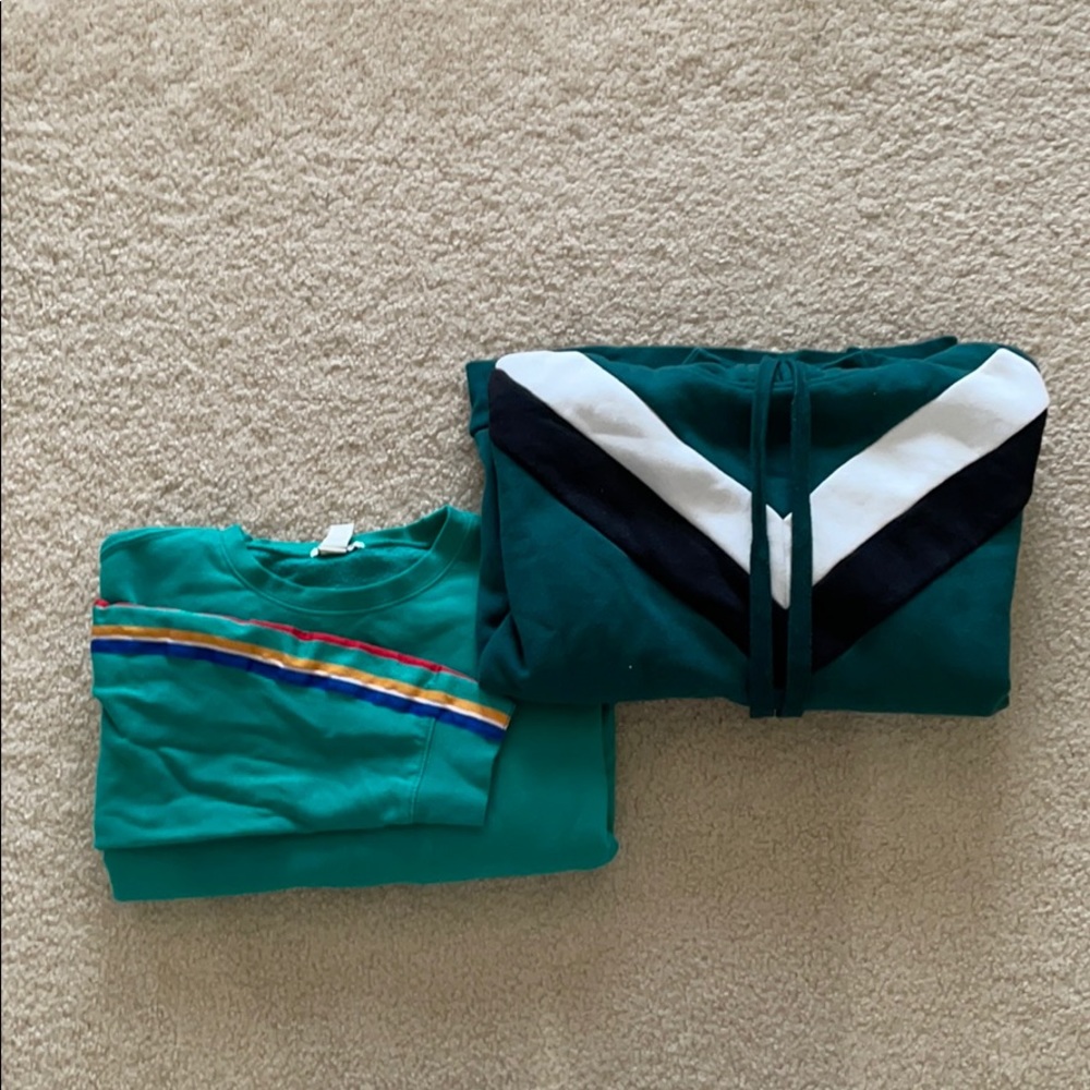 Two green sweaters